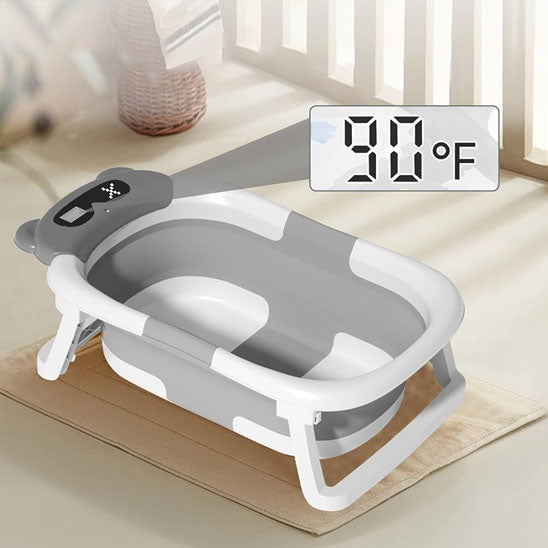 Baignoire pliable bébé avec température gris sur tapis
